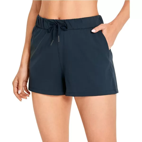 CRZ YOGA Stretch Shorts for Women Casual Work  Athletic Shorts with Pockets Travel Workout Hiking Golf Running Shorts25 inches True Navy