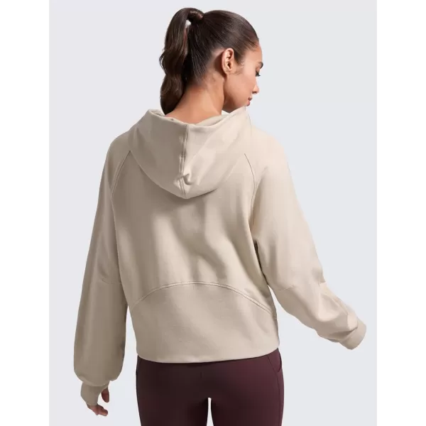 CRZ YOGA Womens Fleece Mock Neck Hoodie Oversized Pullover Long Sleeve Casual Workout Hooded Sweatshirts with Thumb HoleMojave Tan