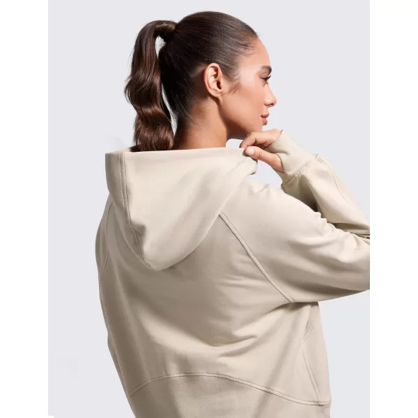 CRZ YOGA Womens Fleece Mock Neck Hoodie Oversized Pullover Long Sleeve Casual Workout Hooded Sweatshirts with Thumb HoleMojave Tan