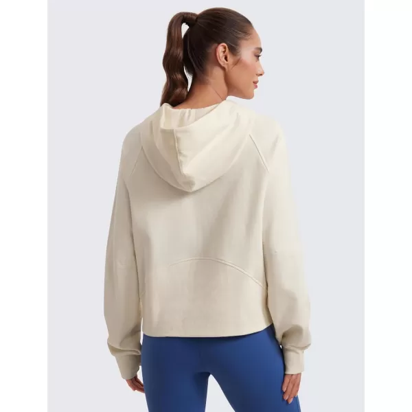 CRZ YOGA Womens Fleece Mock Neck Hoodie Oversized Pullover Long Sleeve Casual Workout Hooded Sweatshirts with Thumb HoleWhite Apricot