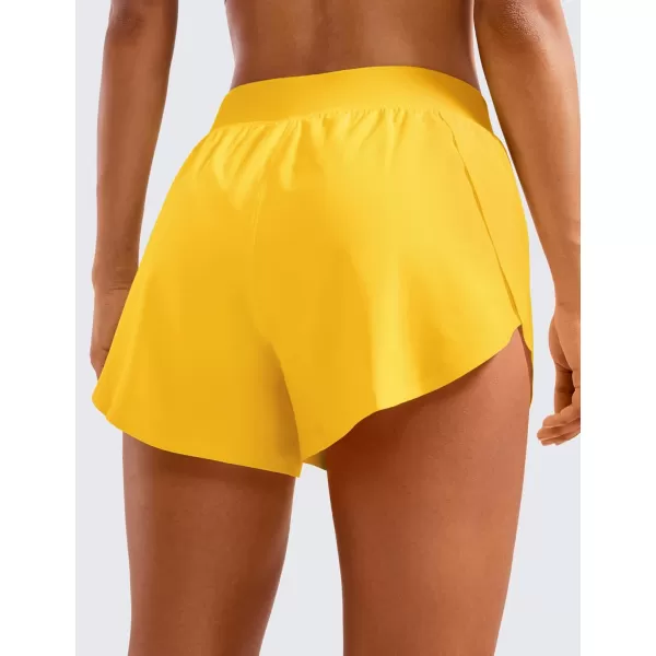 CRZ YOGA Mid Waisted Dolphin Athletic Shorts for Women 4quot Lightweight High Split Gym Workout Shorts with Liner Quick DryHigh Visibility Yellow