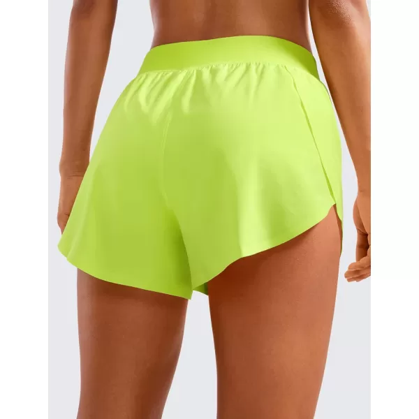 CRZ YOGA Mid Waisted Dolphin Athletic Shorts for Women 4quot Lightweight High Split Gym Workout Shorts with Liner Quick DryNeon Yellow