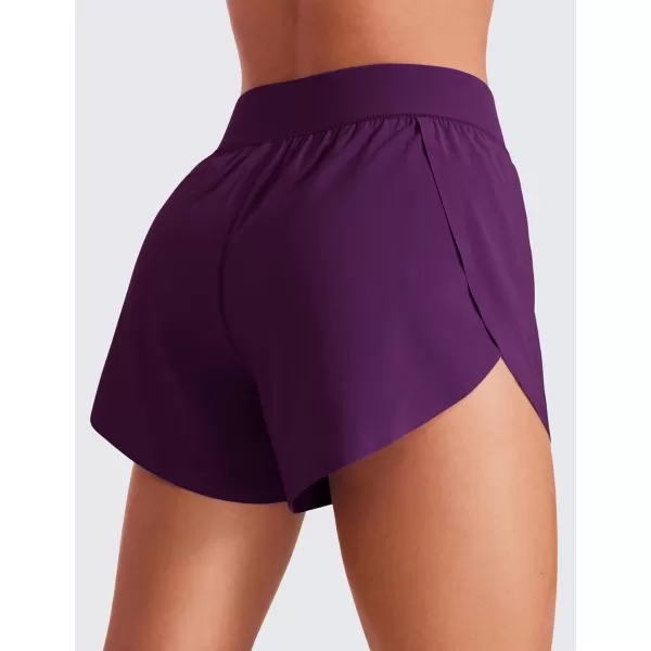 CRZ YOGA Mid Waisted Dolphin Athletic Shorts for Women 4quot Lightweight High Split Gym Workout Shorts with Liner Quick DryPlum Magenta