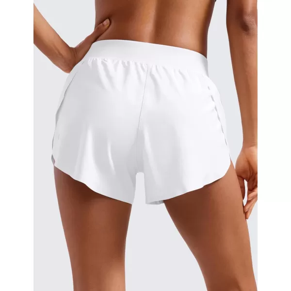 CRZ YOGA Mid Waisted Dolphin Athletic Shorts for Women 4quot Lightweight High Split Gym Workout Shorts with Liner Quick DryWhite