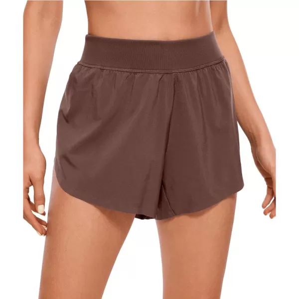 CRZ YOGA Mid Waisted Dolphin Athletic Shorts for Women 4quot Lightweight High Split Gym Workout Shorts with Liner Quick DryTaupe