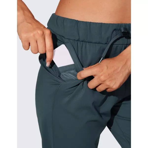 CRZ YOGA 4Way Stretch Workout Joggers for Women 28quot  Casual Travel Pants Lounge Athletic Joggers with PocketsForest Dark Green