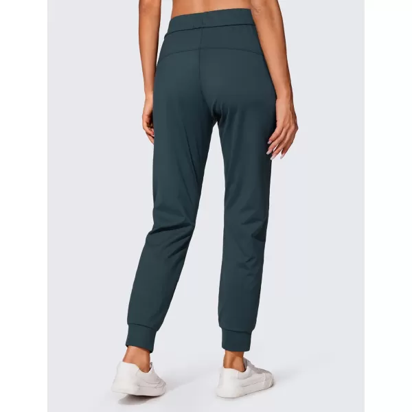 CRZ YOGA 4Way Stretch Workout Joggers for Women 28quot  Casual Travel Pants Lounge Athletic Joggers with PocketsForest Dark Green