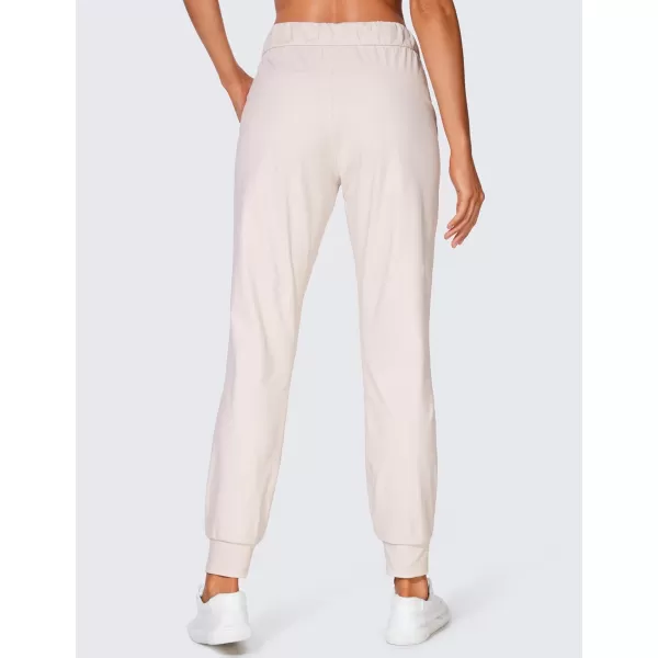 CRZ YOGA 4Way Stretch Workout Joggers for Women 28quot  Casual Travel Pants Lounge Athletic Joggers with PocketsMilky White Bone