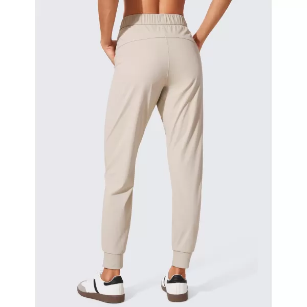 CRZ YOGA 4Way Stretch Workout Joggers for Women 28quot  Casual Travel Pants Lounge Athletic Joggers with PocketsMojave Tan
