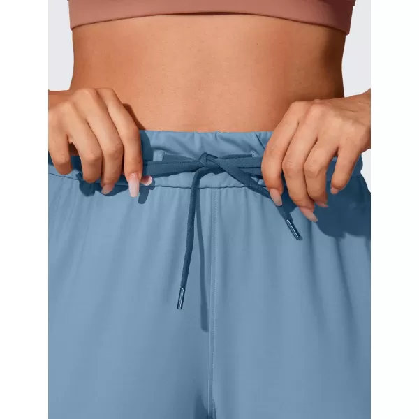 CRZ YOGA 4Way Stretch Workout Joggers for Women 28quot  Casual Travel Pants Lounge Athletic Joggers with PocketsUniverse Blue