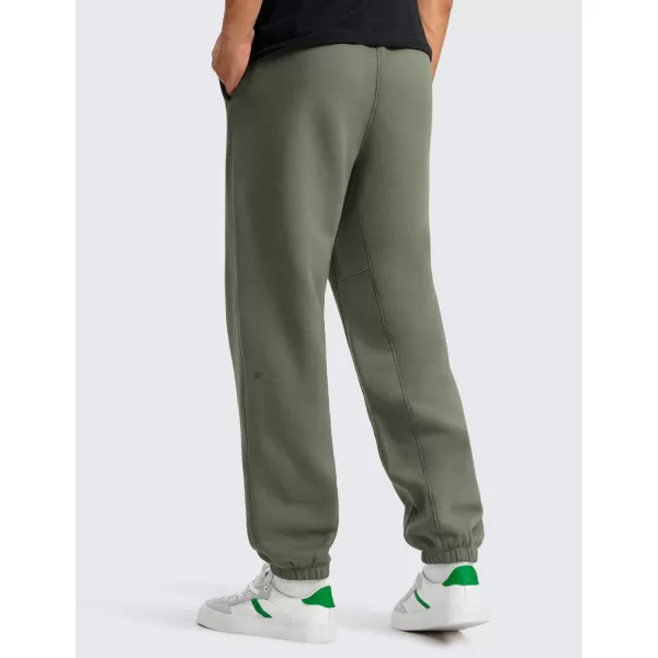 CRZ YOGA Cotton Fleece Sweatpants for Men 32quot Loosed Fit Lounge Casual Elastic Bottom Sweat Pants with Zipper PocketsLight Army Green