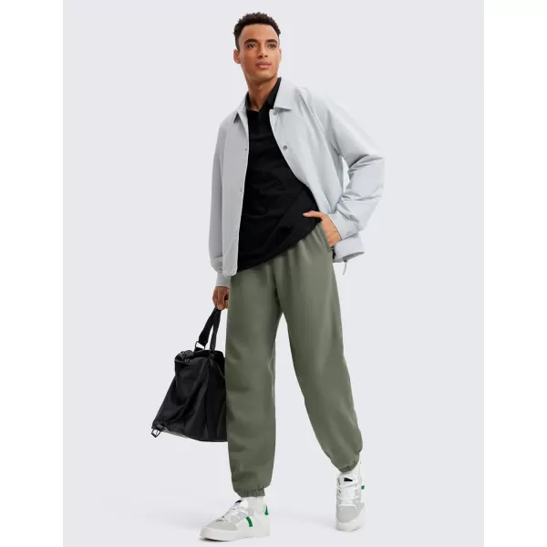 CRZ YOGA Cotton Fleece Sweatpants for Men 32quot Loosed Fit Lounge Casual Elastic Bottom Sweat Pants with Zipper PocketsLight Army Green