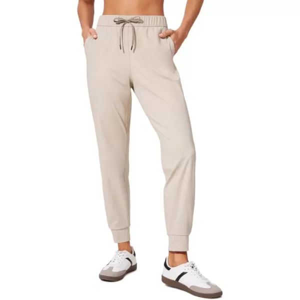 CRZ YOGA 4Way Stretch Workout Joggers for Women 28quot  Casual Travel Pants Lounge Athletic Joggers with PocketsMojave Tan