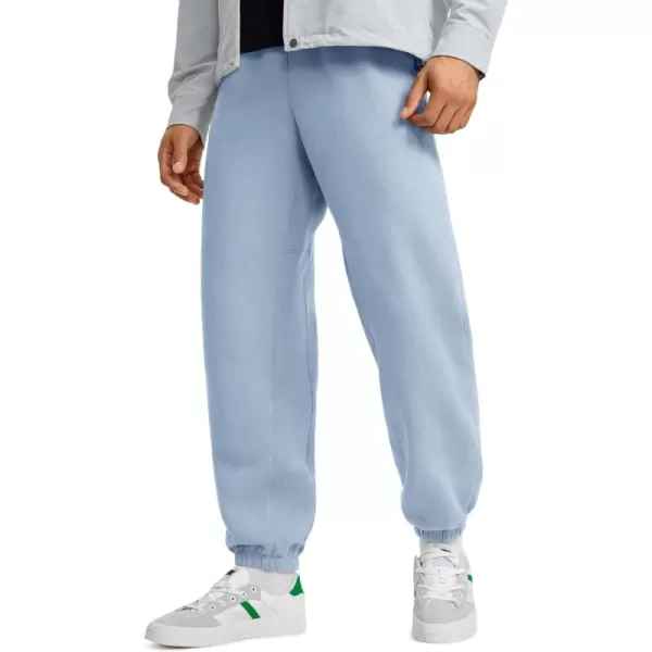 CRZ YOGA Cotton Fleece Sweatpants for Men 32quot Loosed Fit Lounge Casual Elastic Bottom Sweat Pants with Zipper PocketsCambric Blue