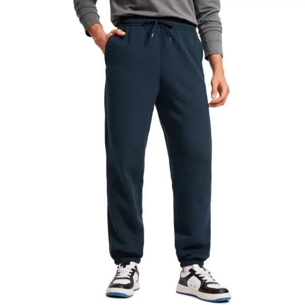 CRZ YOGA Cotton Fleece Sweatpants for Men 32quot Loosed Fit Lounge Casual Elastic Bottom Sweat Pants with Zipper PocketsInk Blue
