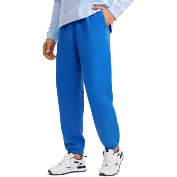 CRZ YOGA Cotton Fleece Sweatpants for Men 32quot Loosed Fit Lounge Casual Elastic Bottom Sweat Pants with Zipper PocketsSparkle Blue