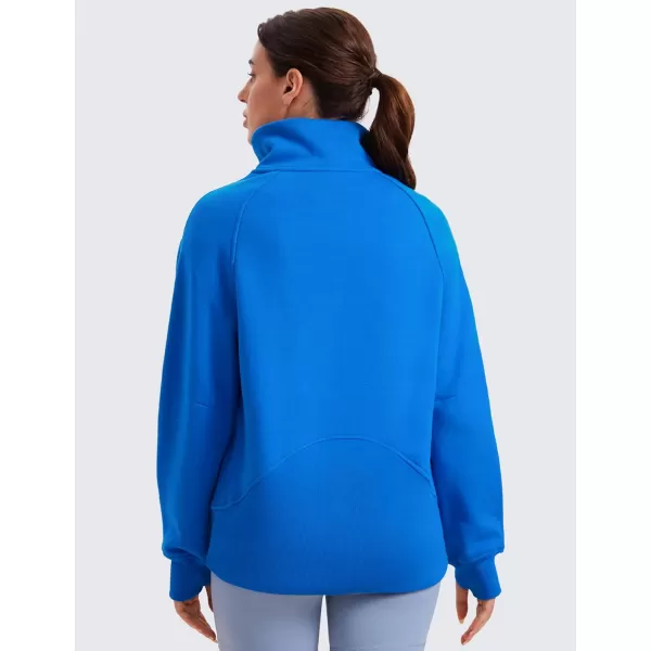 imageCRZ YOGA Womens Fleece Lined Sweatshirts Half Zip Funnel Neck Pullover Long Sleeve Hip Oversized Hoodies with Thumb HolesSparkle Blue