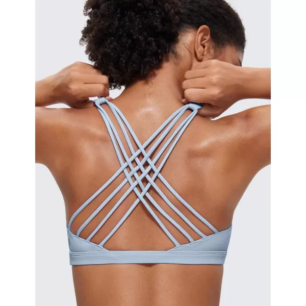 imageCRZ YOGA Strappy Sports Bras for Women  Criss Cross Back Sexy Wireless Padded Yoga Bra Cute WorkoutCambric Blue