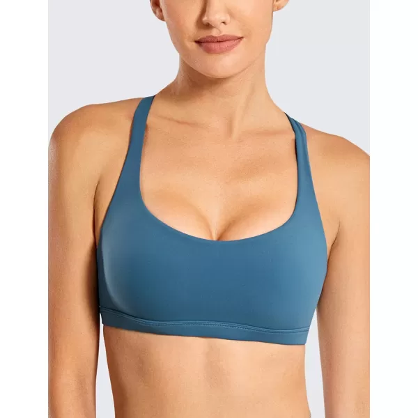 imageCRZ YOGA Strappy Sports Bras for Women  Criss Cross Back Sexy Wireless Padded Yoga Bra Cute WorkoutPetrol Blue