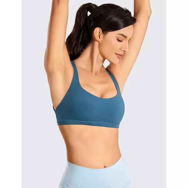 imageCRZ YOGA Strappy Sports Bras for Women  Criss Cross Back Sexy Wireless Padded Yoga Bra Cute WorkoutPetrol Blue