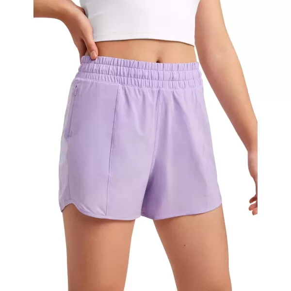 imageCRZ YOGA Girls Athletic Shorts with Zipper Pocket Lightweight Running Shorts for Teen Girls Kids LinerLilac