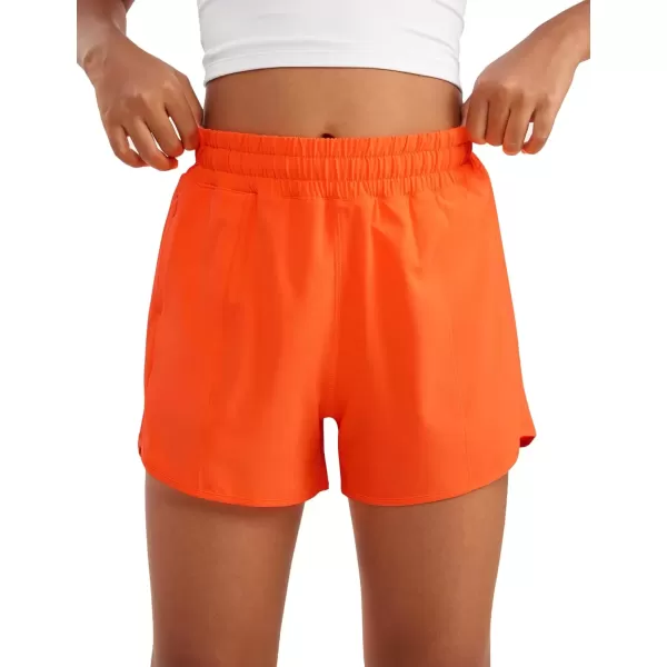 imageCRZ YOGA Girls Athletic Shorts with Zipper Pocket Lightweight Running Shorts for Teen Girls Kids LinerNeon Orange