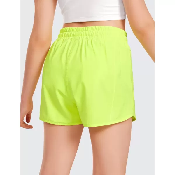 imageCRZ YOGA Girls Athletic Shorts with Zipper Pocket Lightweight Running Shorts for Teen Girls Kids LinerNeon Yellow