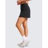 imageCRZ YOGA A Line Golf Skirts for Women High Waisted Casual Tennis Pickleball Athletic Skorts with Shorts PocketsBlack