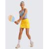 imageCRZ YOGA A Line Golf Skirts for Women High Waisted Casual Tennis Pickleball Athletic Skorts with Shorts PocketsHigh Visibility Yellow