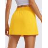 imageCRZ YOGA A Line Golf Skirts for Women High Waisted Casual Tennis Pickleball Athletic Skorts with Shorts PocketsHigh Visibility Yellow