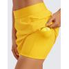 imageCRZ YOGA A Line Golf Skirts for Women High Waisted Casual Tennis Pickleball Athletic Skorts with Shorts PocketsHigh Visibility Yellow
