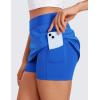 imageCRZ YOGA A Line Golf Skirts for Women High Waisted Casual Tennis Pickleball Athletic Skorts with Shorts PocketsSparkle Blue
