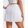 imageCRZ YOGA A Line Golf Skirts for Women High Waisted Casual Tennis Pickleball Athletic Skorts with Shorts PocketsWhite