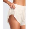 imageCRZ YOGA High Waisted Dolphin Athletic Running Shorts for Women 3quot High Split Comfy Mesh Liner for Gym Workout TrackWhite Apricot