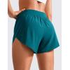 imageCRZ YOGA Mid Waisted Dolphin Athletic Shorts for Women 4quot Lightweight High Split for Gym Workout with Liner Quick DryBorealis Green