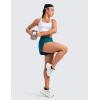 imageCRZ YOGA Mid Waisted Dolphin Athletic Shorts for Women 4quot Lightweight High Split for Gym Workout with Liner Quick DryBorealis Green