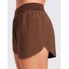 imageCRZ YOGA Mid Waisted Dolphin Athletic Shorts for Women 4quot Lightweight High Split for Gym Workout with Liner Quick DryCoffee Brown