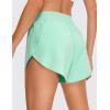 imageCRZ YOGA Mid Waisted Dolphin Athletic Shorts for Women 4quot Lightweight High Split for Gym Workout with Liner Quick DryMint Moment