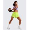 imageCRZ YOGA Mid Waisted Dolphin Athletic Shorts for Women 4quot Lightweight High Split for Gym Workout with Liner Quick DryNeon Yellow