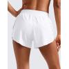 imageCRZ YOGA Mid Waisted Dolphin Athletic Shorts for Women 4quot Lightweight High Split for Gym Workout with Liner Quick DryWhite