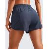 imageCRZ YOGA Womens High Waisted Running Shorts Mesh Liner 3 Dolphin Quick Dry for Athletic Gym Track Workout with Zip PocketNavy