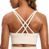 imageCRZ YOGA Womens Strappy Longline Sports Bra  Medium Impact Criss Cross Yoga Padded Workout Crop TopWhite Apricot