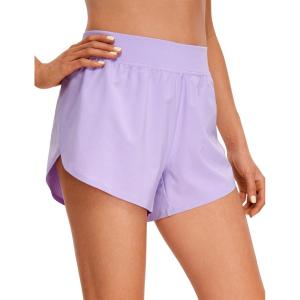 imageCRZ YOGA Mid Waisted Dolphin Athletic Shorts for Women 4quot Lightweight High Split for Gym Workout with Liner Quick DryLilac