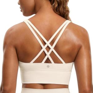 imageCRZ YOGA Womens Strappy Longline Sports Bra  Medium Impact Criss Cross Yoga Padded Workout Crop TopWhite Apricot