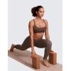 imageCRZ YOGA Strappy Sports Bras for Women  Criss Cross Back Wireless Padded Yoga Workout Cami TopTaupe