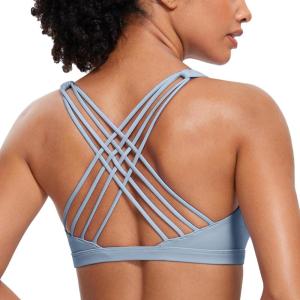 imageCRZ YOGA Strappy Sports Bras for Women  Criss Cross Back Wireless Padded Yoga Workout Cami TopCambric Blue