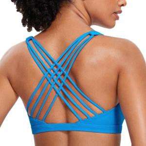 imageCRZ YOGA Strappy Sports Bras for Women  Criss Cross Back Wireless Padded Yoga Workout Cami TopMadagascar Blue
