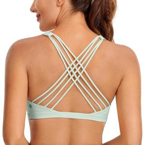 imageCRZ YOGA Strappy Sports Bras for Women  Criss Cross Back Wireless Padded Yoga Workout Cami TopPale Straw Green