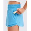 imageCRZ YOGA Girls Athletic Shorts with Zip Pocket  High Waist Flowy Ruffle Skirt for Workout Running Tennis Teen Kids LinerKayak Blue