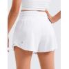 imageCRZ YOGA Girls Athletic Shorts with Zip Pocket  High Waist Flowy Ruffle Skirt for Workout Running Tennis Teen Kids LinerWhite